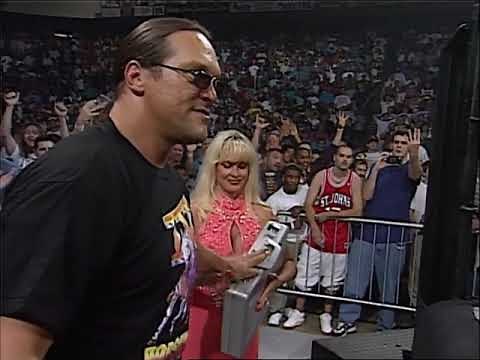 Ric Flair (with Elizabeth, Woman & Debra) vs Macho Man Randy Savage. Horseman jump Macho!