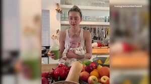 Amber Heard drinks a green juice with her baby girl Oonagh