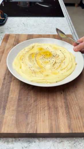 Perfect Potatoes Part 3. Mashed Potatoes/Pomme Puree Usually stirs up some comments this one, if you like potato skin and lumps if your mash that’s all good for me. This is just what I consider to be best way to make them maybe it’s a chef thing but you do you friends! Makes enough for 4 good portions 800g Maris piper potatoes 150ml whole milk 50ml double cream 2 garlic cloves Few sprigs of thyme Good pinch of salt 250-300g cold diced butter Melted butter Black pepper 1. Bake the potatoes at 200