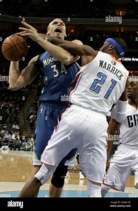 Minnesota Timberwolves' Greg Stiemsma (34) is fouled by Charlotte Bobcats' Hakim Warrick (21) during the first half of an NBA basketball game in Charlotte, N.C., Saturday, Jan. 26, 2013. (AP Photo/Chuck Burton Stock Photo - Alamy