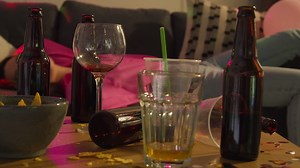 Free stock video - Woman lying passed out on sofa after drinking alcohol at house party suffering with hangover