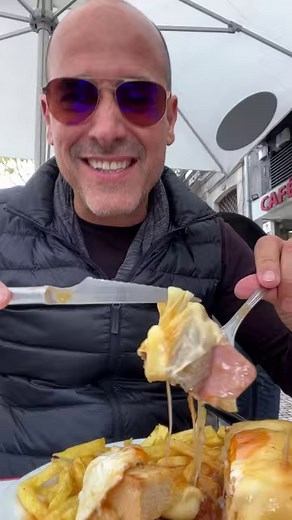In Porto, having the Francesinha at Cafe Santiago da praca is a must! Made with toasted bread, steak, sausage, bacon, cheese, egg, side of fries, more cheese, and topped with gravy. It's the healthiest thing ever... I swear!! #Portugal #Porto #Francesinha #EatingDirty | DAVID ROCCO