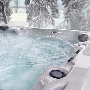 Brave the cold and spend some time relaxing in your hot tub by Master Spas. | Master Spas