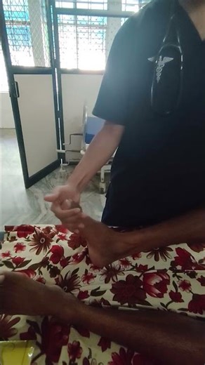 Demonstrating Ankle clonus in a patient with spastic hemipareis
