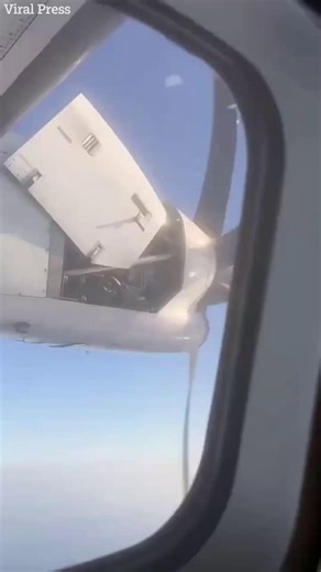 Terrifying moment passengers watch plane engine breaking apart mid-air | The Sun News