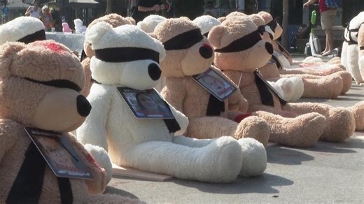 Blindfolded teddy bears in central Tel Aviv square.