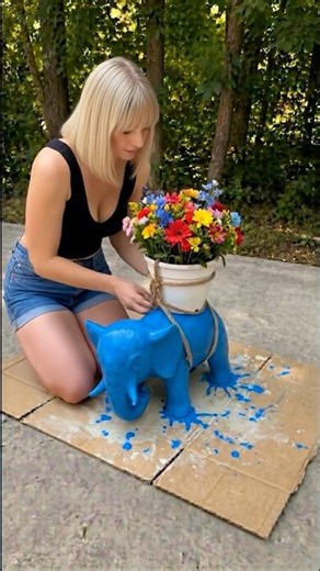 Turning a stuffed elephant into the cutest garden decor ever 🐘🌸 #elephant #gardendecor #diygarden
