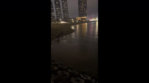 Fluorescent sea glows after splash at Liaoning beach, China