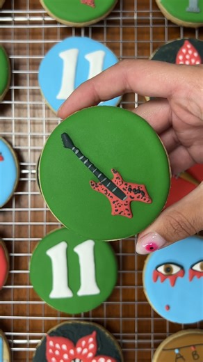 Iced Kitchen | Monthly Cookie Decorating on Instagram: "Eddie's guitar deserved better than the Upside Down 🎸 Download the free guide (link in bio) for the complete step-by-step tutorial for this cookie and 10 others in the complete Stranger Things inspired set! Perfect for honoring our favorite dungeon master - because Eddie Munson deserves all the tributes. #StrangerThings #EddieMunson #guitar #cookiedecorating #beginnerfriendly"