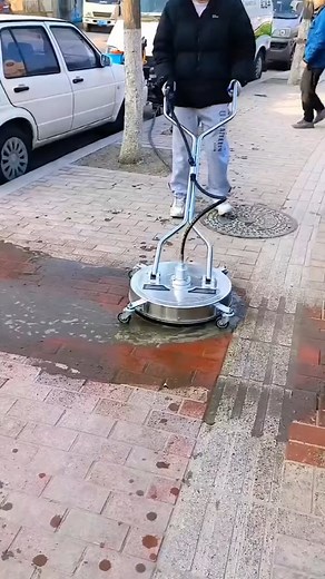 Invention Shark on Instagram: "The video showcases a high-pressure water cleaning machine with a circular design. The machine is specifically engineered for cleaning outdoor streets, sidewalks, and other large paved areas. Its round shape features a rotating water jet system that delivers powerful, concentrated pressure to effectively remove dirt, grime, and debris. As it moves across the surface, it leaves the streets and sidewalks spotless and refreshed, making it a highly efficient tool for u
