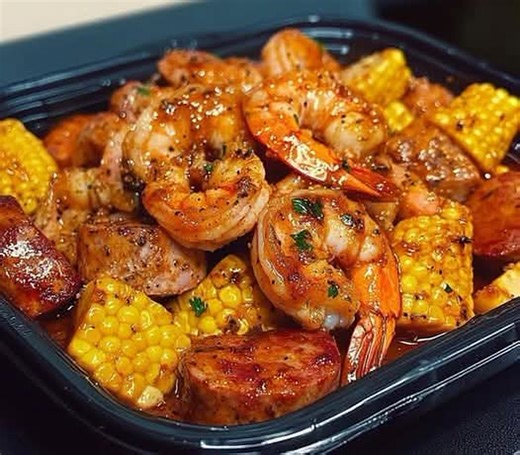 Cajun Shrimp Boil in Garlic Butter Sauce Ingredients: 1 lb large shrimp, peeled and deveined (leave tails on) 2 ears of corn, cut into thirds 4 small red potatoes, halved 2 smoked sausages, sliced thick 3 boiled eggs, peeled 1/2 cup unsalted butter 1/4 cup olive oil 6 cloves garlic, minced 2 tbsp Cajun seasoning 1 tsp smoked paprika 1 tbsp lemon juice 1 tbsp chopped parsley Salt and pepper to taste Instructions: 1. In a large pot, boil the red potatoes in salted water for about 10 minutes. 2. Ad