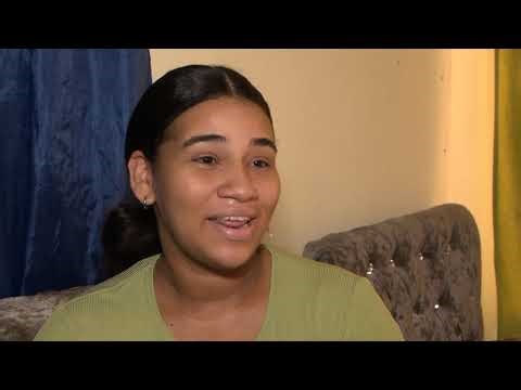 Young woman with newborn baby left out in the open after rain