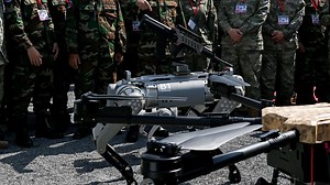 China unveils robot ‘dogs of wars’ with machine guns mounted on their backs