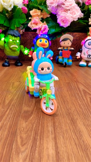 Cute blue rabbit riding a bike around the duck panda hulk