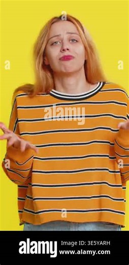 Upset frustrated annoyed Caucasian blonde woman in blouse raising hands in indignant expression, quarreling, asking reason of conflict, why such stubborn. Adult girl isolated on yellow background Stock Video Footage - Alamy