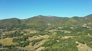 Aerial landscape of the countryside. Fields, gardens, trees, farmland, mountains
