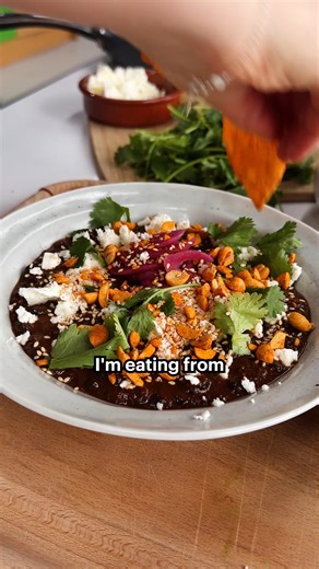This is proof that batch cooking doesn’t have to be boring 🔥 Cassie's black bean mole brings big flavour – sweet, smoky, nutty and deeply comforting, finished with pickled onions, creamy feta and crunchy seeds. Make a big batch, chuck it in your freezer and you’ve got a bowl of Mexican-inspired goodness for when you need it. Get the full recipe in the February issue of Good Food magazine, or search ‘Smoky peanut butter mole with black beans’ on the Good Food app, where you can find all of Cassi