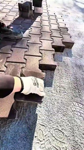 Installing interlocking paving stones on a sand base for a durable and very attractive walkway path