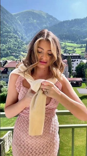 How to tie a sweater around your neck with an adjustable knot as it starts to get more chilly