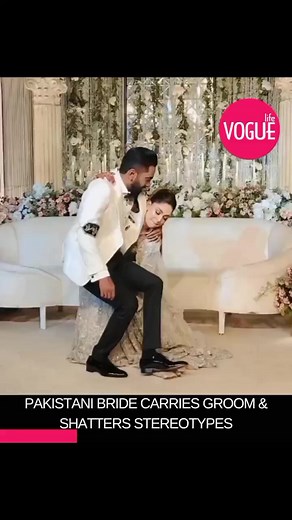 1.8K views · 32 reactions | Pakistani Bride Carries Groom and Shatters ‘Mardana’ Stereotypes A young Pakistani bride from Lahore broke desi stereotypes by picking her husband up in her arms on their wedding day. The clip of the powerful dulhan cradling her groom like a baby has gone viral and is setting new standards of female empowerment. #bride #groom #husband #wife #wedding #marriage #female #empowerment #lahore #stereotypes #pakistani #weddingday #news | Vogue Life | Facebook