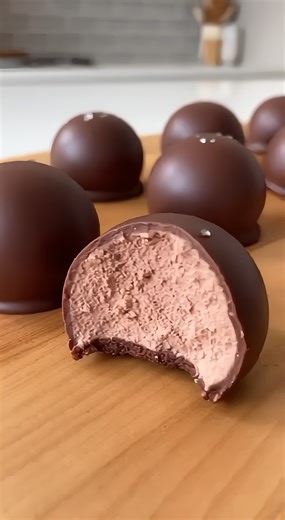 3-Ingredient Cool Whip Candy Chocolate Mousse Truffles Ingredients: 12 oz (340 g) Semi-sweet chocolate chips 8 oz (225 g) Whipped topping (Cool Whip), thawed 12 oz (340 g) Chocolate melting wafers or coating chocolate Directions: 1. Place chocolate chips in a heat-safe bowl and melt in the microwave or over a double boiler until smooth. 2. Gently fold the thawed whipped topping into the melted chocolate until a thick, uniform mousse-like dough forms. 3. Place the mixture in the freezer until it 