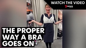 Lingerie expert demonstrates the proper way to put on a bra