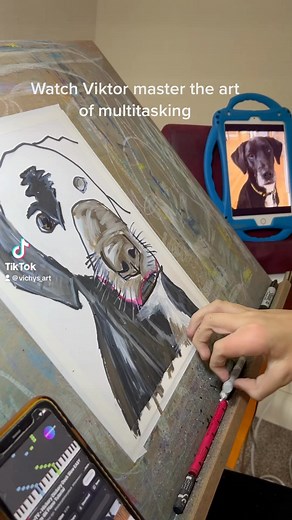 3.4K views · 558 reactions | Watch Viktor master the art of multitasking - he draws with one hand while playing on his phone with the other, all while remaining completely focused. Although his artwork appears a bit haphazard, the final product is absolutely stunning. #vichysart #viktorbevanda #petsportrait #autism | Vichy’s art | Facebook