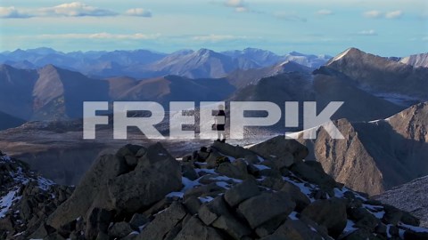 Hikers top of snow covered Mt Mount Shavano Taeguache Peak aerial drone Colorado Collegiate peaks golden hour Rocky Mountains Huron Peak Mt Elbert Sawatch Range fall autumn parallax circle motion | Premium Stock Video Footage