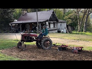 Tractor therapy, disking garden with a ￼￼1949 Farmall cub, 23-A tandem disk set￼