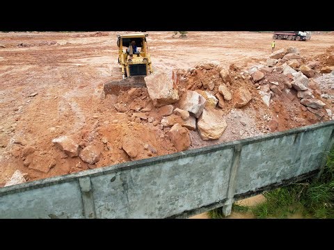 Good Action! Be Careful Driver Komatsu D68E Bulldozer Pushing Huge Stones Filling Along The Fence