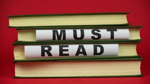 clip-3977763283-stack-books-words-“must-read”-printed-bold