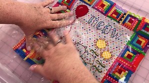 Video Tutorial Two for the Meow and Woof Stitcheries! Julie shows you how easy it is to dissolve your Kitty Says Meow Stitchery or your Doggie Says Woof Stitchery! (Links below in this post.) The stitchery patterns come pre-printed on Sulky Stick N Stitch which is a dissolvable stabilizer. It is very easy to use for hand-embroidery ... we recommend Tulip Needles. (Links below in this post.) Once you are done stitching, simply soak your stitchery or run it under warm water. Wait for your stitcher