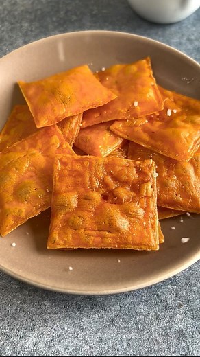 Ain’t Too Proud To Meg | Cheese, Charcuterie & More on Instagram: "SAVE this post & make ur own Homemade CHEEZE-ITS with only 1 ingredients. 🧀💛 Definitely recommend making for fun. Recipe ⬇️ #AintTooProudToCheese I saw this first on @grazinthroughlife and follower her recipe. INGREDIENTS - Ultra thin cheddar cheese slices - Salt to taste INSTRUCTIONS 1. Quarter the cheese slices and lay them on a baking sheet lined with parchment paper. 2. Use a straw to create a hole in the middle of each qua