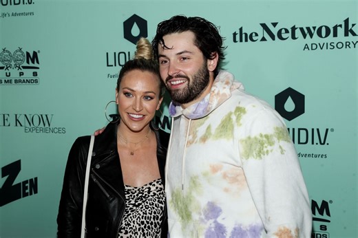 Baker Mayfield's wife Emily shows off physical strength lifting heavy chest press with huge baby belly as due date nears