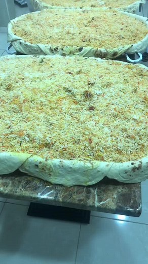 Deliciously Topped Rectangular Pizza Preparation