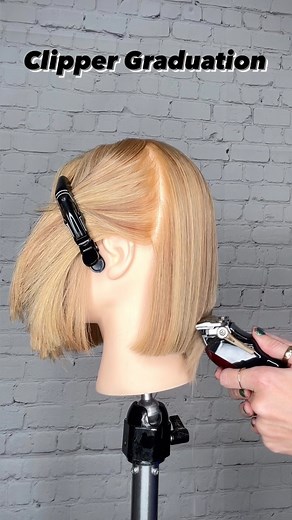 Have you ever cut a graduated bob using just your clipper? If not, you should give it a try! It’s all about pressure. Use light pressure and softly paint down the hair. This is a great freehand technique for curly hair as well. Drop a 🔥 if you can’t wait to try this. . . Clippers: @wahlpro Magic Clip . . . . . #creativecutting #clippernation #barbershopconnect #clipperbob #bobhaircut #graduatedbob #crafthairdresser #fringebangs #haircuttutorial #cuttingshapes #haircut #curtainbangs #faceframe #