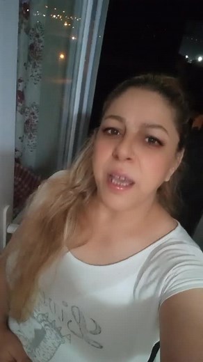 Nighttime Reflections: A Person in a Cozy Room