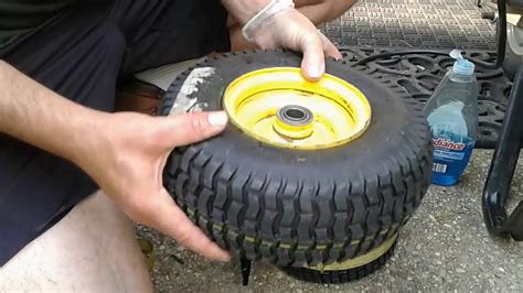Reinstall the tire onto the lawn mower