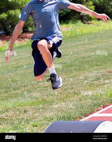 Athlete jumping into pit