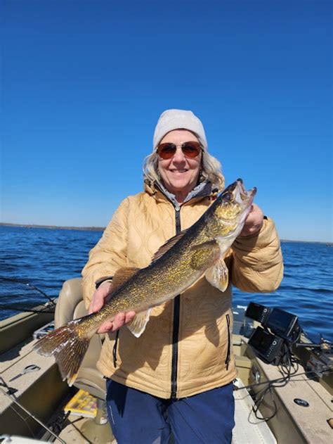 A fisherman holding live bait for catching fish on Lake Winnibigoshish