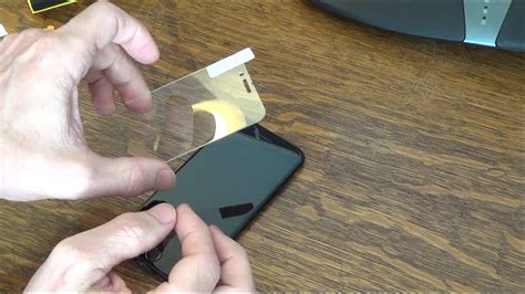 placing tempered glass over phone case