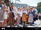 TALLINN, ESTONIA - 04 JUL 2014: People in Estonian costumes going at ...