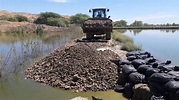 Refuerzan dique en lagunas de oxidación de Los Órganos - Cutivalú Piura