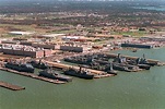An aerial view of a portion of the Norfolk Naval Station showing piers ...