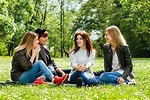 Young girls talking in park — Stock Photo © inesbazdar #85506838