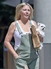 Heather Locklear appears to be talking to herself while balancing on a ...