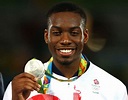 Silver medalist Lutalo Muhammad of Great Britain poses on the podium ...