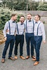 a stylish groom's outfit with navy pants and suspenders, light blue ...