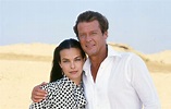 Carole Bouquet and Roger Moore on location at St. George's Beach, Corfu ...