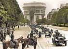 Motorized troops of the 30. Infanterie-Division drive down the Champs-Élysées during the victory ...